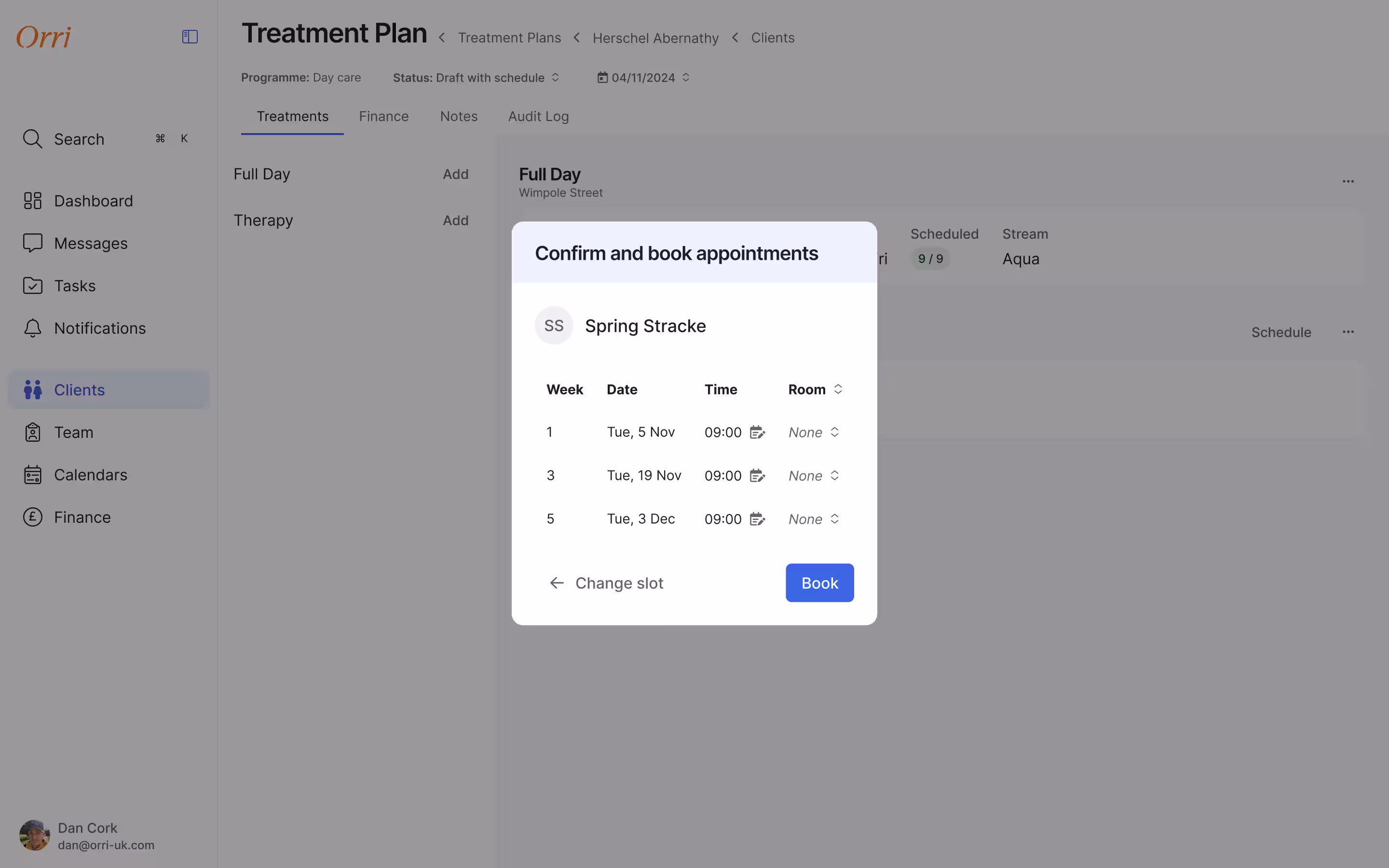 Confirm and book appointments modal listing three sessions for clinician Spring Stracke by week and date, each with an editable time and a room selector, above a book button